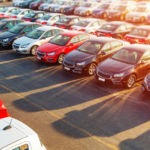 Sun Shining on Cars in a Parking Lot | Why Auto Dealers Are Struggling to Retain Service Advisors | Safeguard