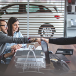 Car salesman shaking hands with customer | The Road to Success: 3 Tips for Running a Successful Car Dealership | Safeguard
